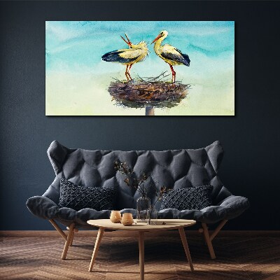 Storks on a nest in the blue Print on canvas