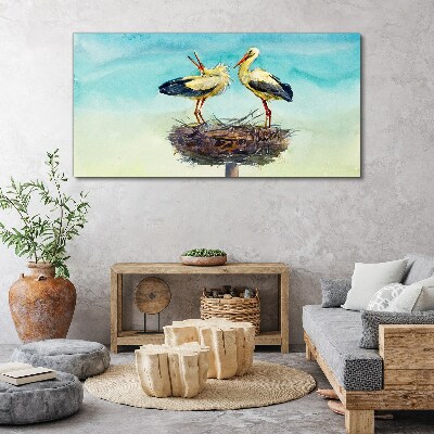 Storks on a nest in the blue Print on canvas