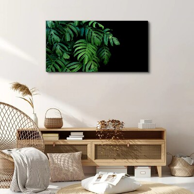 Green leaves on a black background Print on canvas