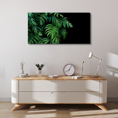 Green leaves on a black background Print on canvas