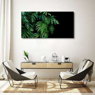 Green leaves on a black background Print on canvas