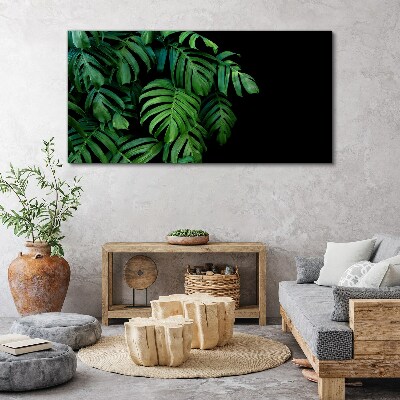 Green leaves on a black background Print on canvas