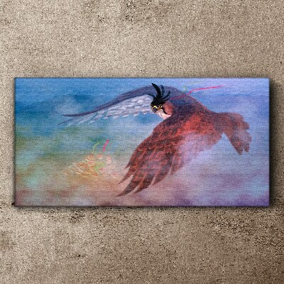 Flight of a bird of prey in the clouds Print on canvas