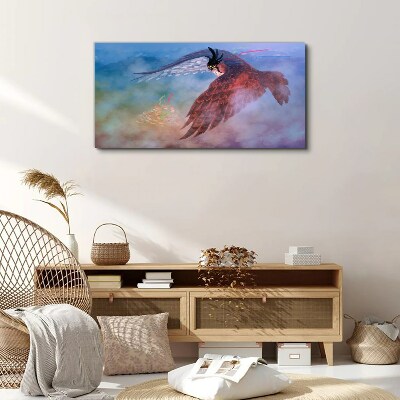 Flight of a bird of prey in the clouds Print on canvas