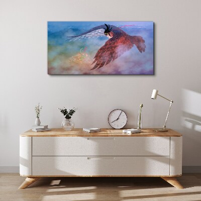 Flight of a bird of prey in the clouds Print on canvas