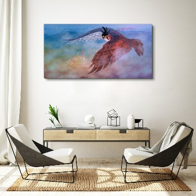 Flight of a bird of prey in the clouds Print on canvas