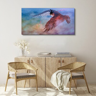 Flight of a bird of prey in the clouds Print on canvas