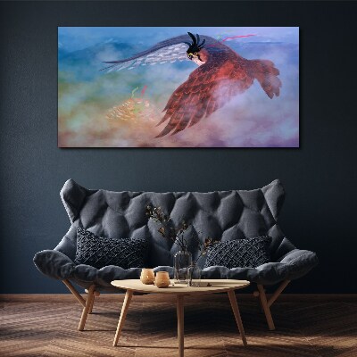 Flight of a bird of prey in the clouds Print on canvas
