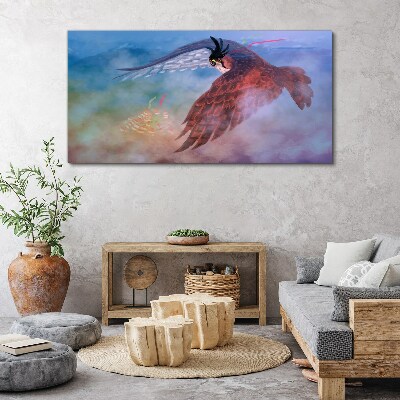 Flight of a bird of prey in the clouds Print on canvas