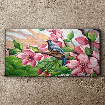 A bird against a background of spring flowers Canvas wall art