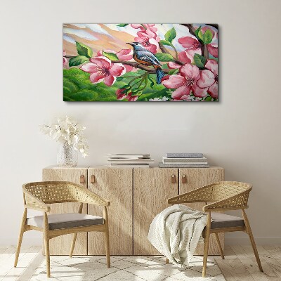 A bird against a background of spring flowers Canvas wall art