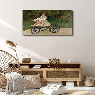 Child on a ride-on Print on canvas