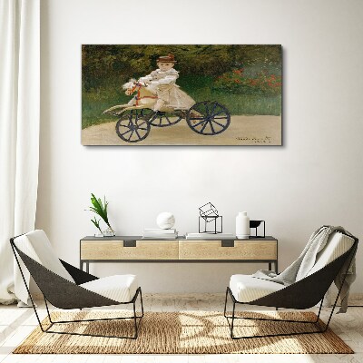 Child on a ride-on Print on canvas