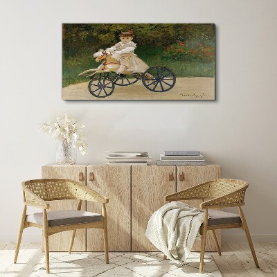 Child on a ride-on Print on canvas