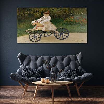 Child on a ride-on Print on canvas