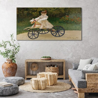 Child on a ride-on Print on canvas