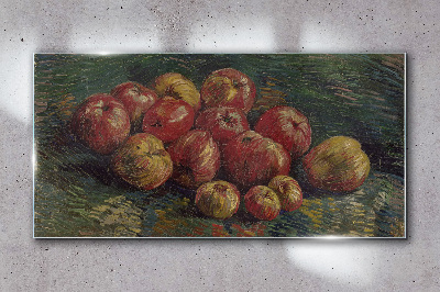 Apples on a green background Glass art print