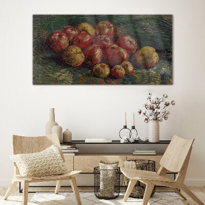 Apples on a green background Glass art print
