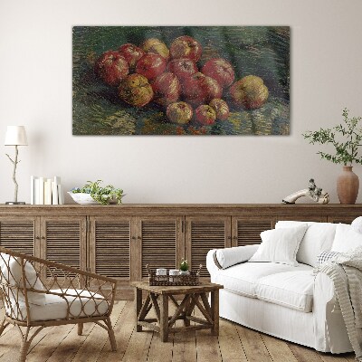 Apples on a green background Glass art print