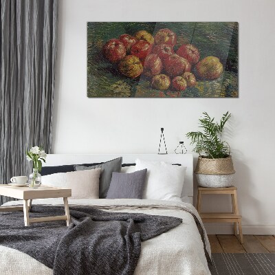 Apples on a green background Glass art print