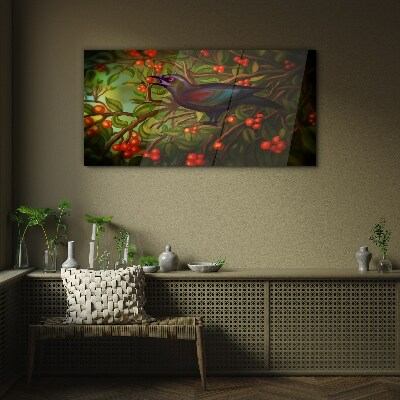A bird on a fruit branch in the background Glass art print