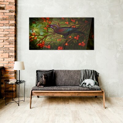 A bird on a fruit branch in the background Glass art print