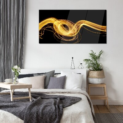 Golden streaks of light on black Glass art print