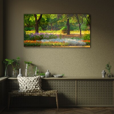 A flower paradise in a sunny garden Glass art print
