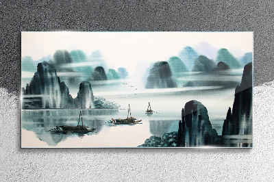 A peaceful lake in a mountain landscape Glass art print