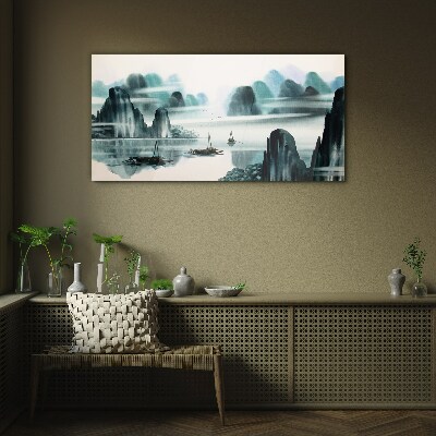 A peaceful lake in a mountain landscape Glass art print