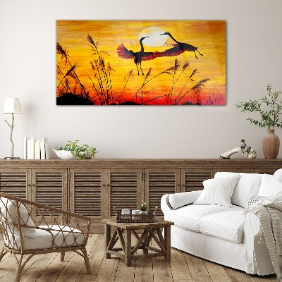 Dancing cranes at sunset Glass art print