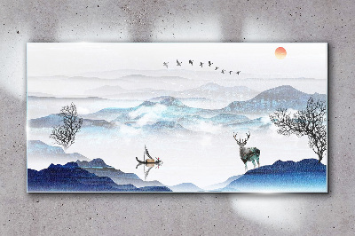A peaceful mountain landscape with a deer Glass art print
