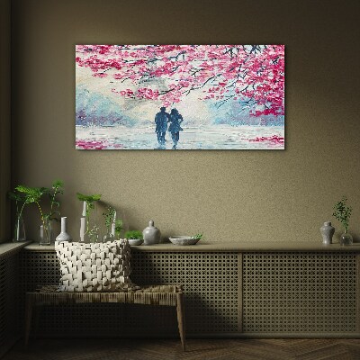 A spring walk under the blooming trees Glass art print