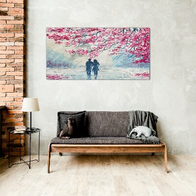 A spring walk under the blooming trees Glass art print