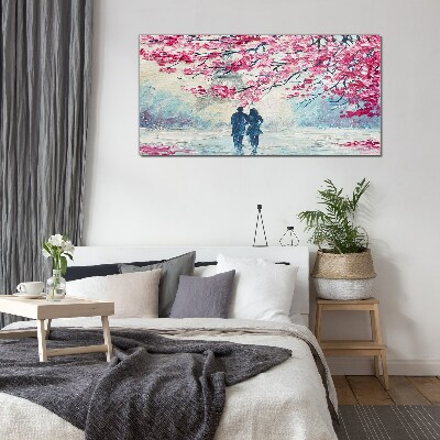 A spring walk under the blooming trees Glass art print