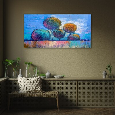 Colorful trees on a blue background Glass art print
