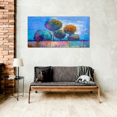Colorful trees on a blue background Glass art print