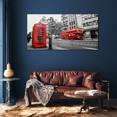 Red telephone in a grey city Wall art on glass