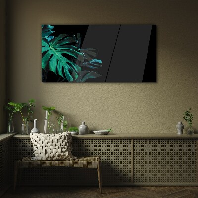 Green leaves on a black background Glass art print
