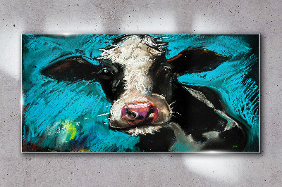 Portrait of a cow on a blue background Glass art print