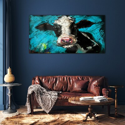 Portrait of a cow on a blue background Glass art print