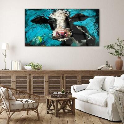 Portrait of a cow on a blue background Glass art print