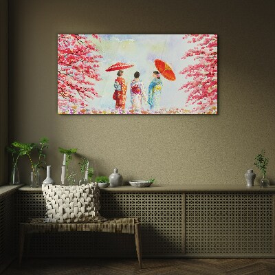 A spring walk under the blooming trees Glass art print