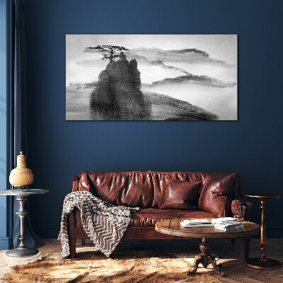 A lonely tree on a rocky mountain Glass art print