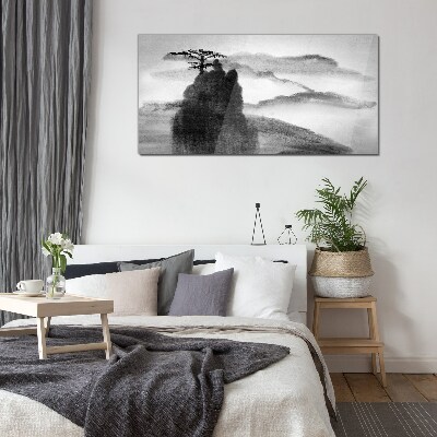 A lonely tree on a rocky mountain Glass art print