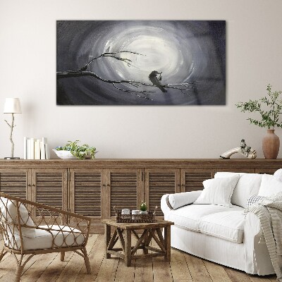 A lonely bird on a branch Wall art on glass
