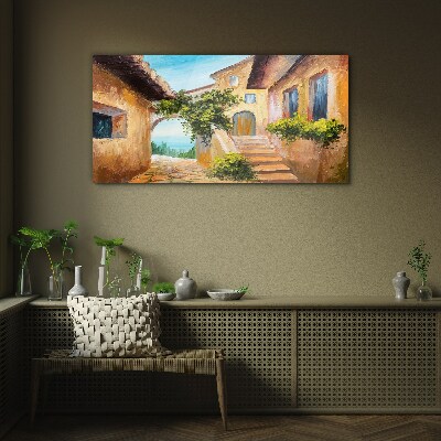 The charming streets of a seaside village Wall art on glass