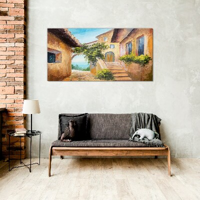 The charming streets of a seaside village Wall art on glass