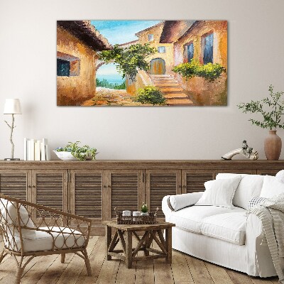 The charming streets of a seaside village Wall art on glass