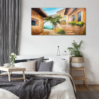 The charming streets of a seaside village Wall art on glass